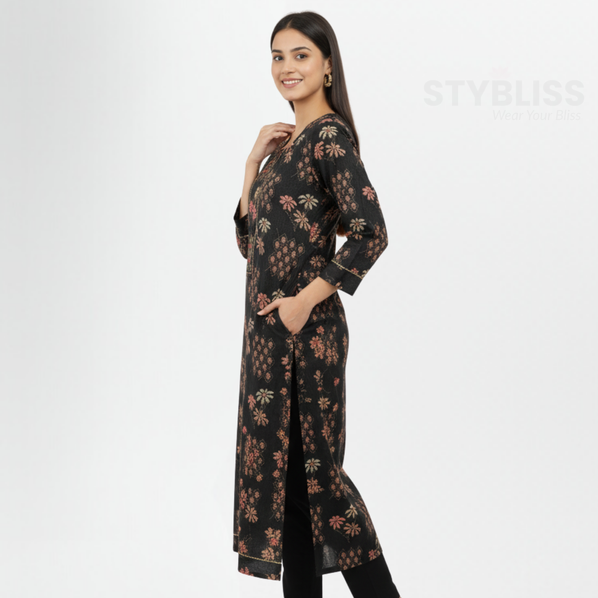 Woman wearing a black floral dress with a white background, featuring the brand 'Stybliss'.
